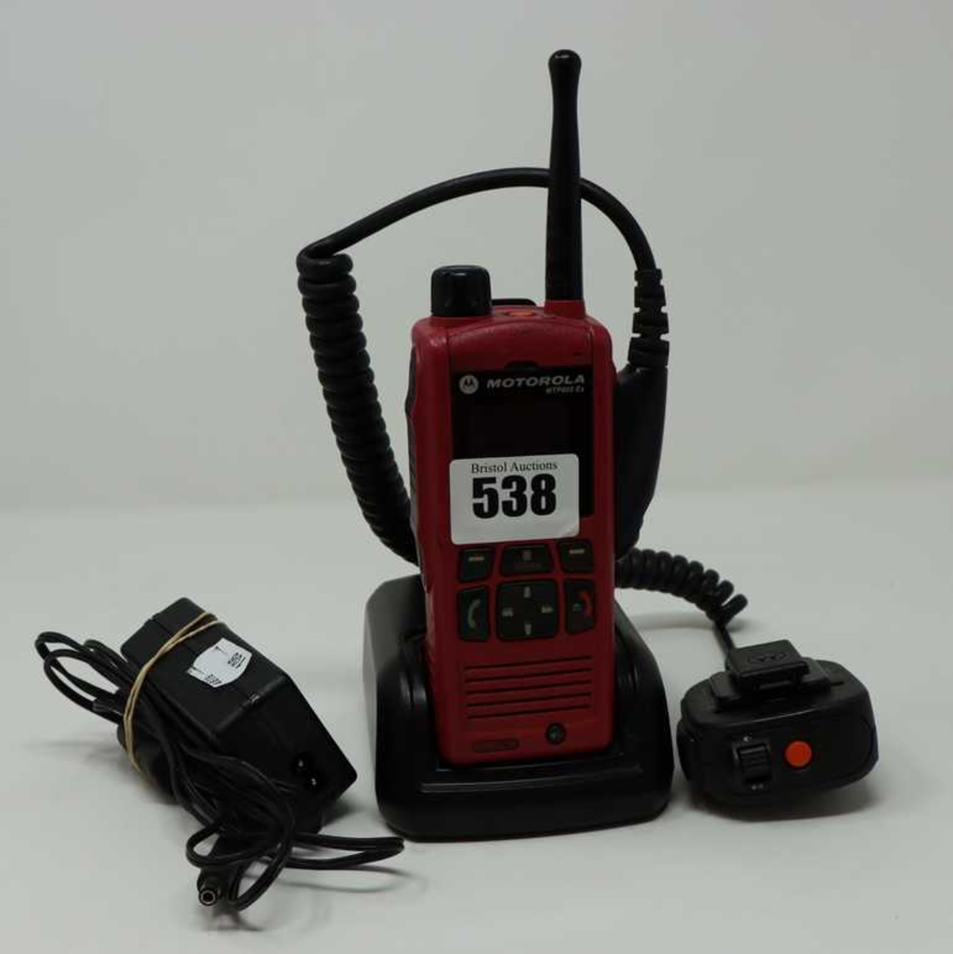 A pre-owned Motorola MTP850Ex Tetra ATEX Two Way Radio with charging dock.