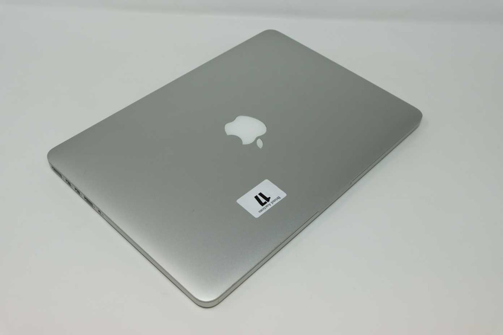 A pre-owned MacBook Pro Retina A1502 sold for parts (Serial: C02SM9SEFVH3) (Powers on and