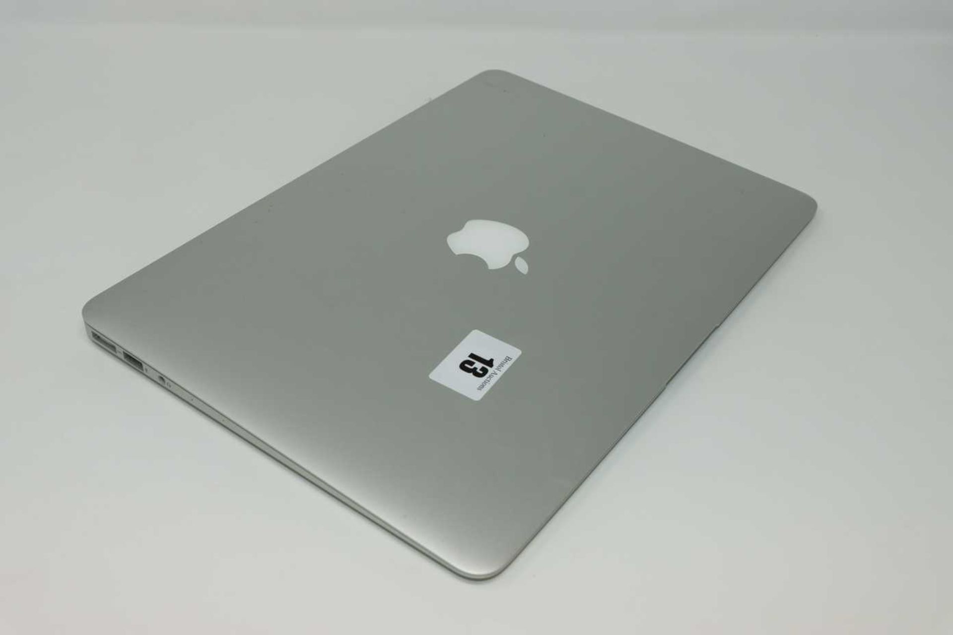 A pre-owned MacBook Air A1466 sold for parts (Serial: FVHX4ABCJ1WK) (Does not power on. Liquid