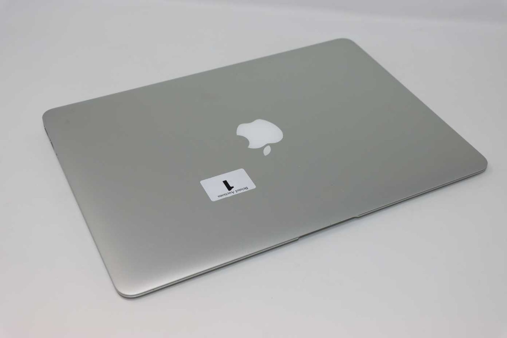 A pre-owned MacBook Air A1466 (Serial: FVFV7DUGJ1WL) (Liquid Damage), HD removed. Turns on and