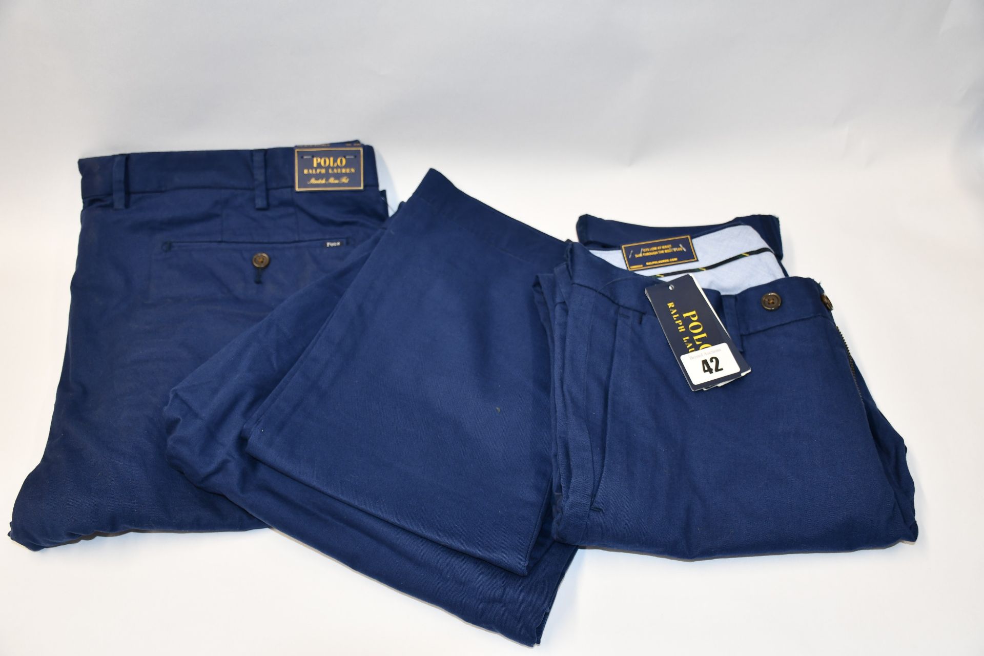 Three pairs of as new Ralph Lauren Polo stretch slim fit men's classic Blue chino style trousers (