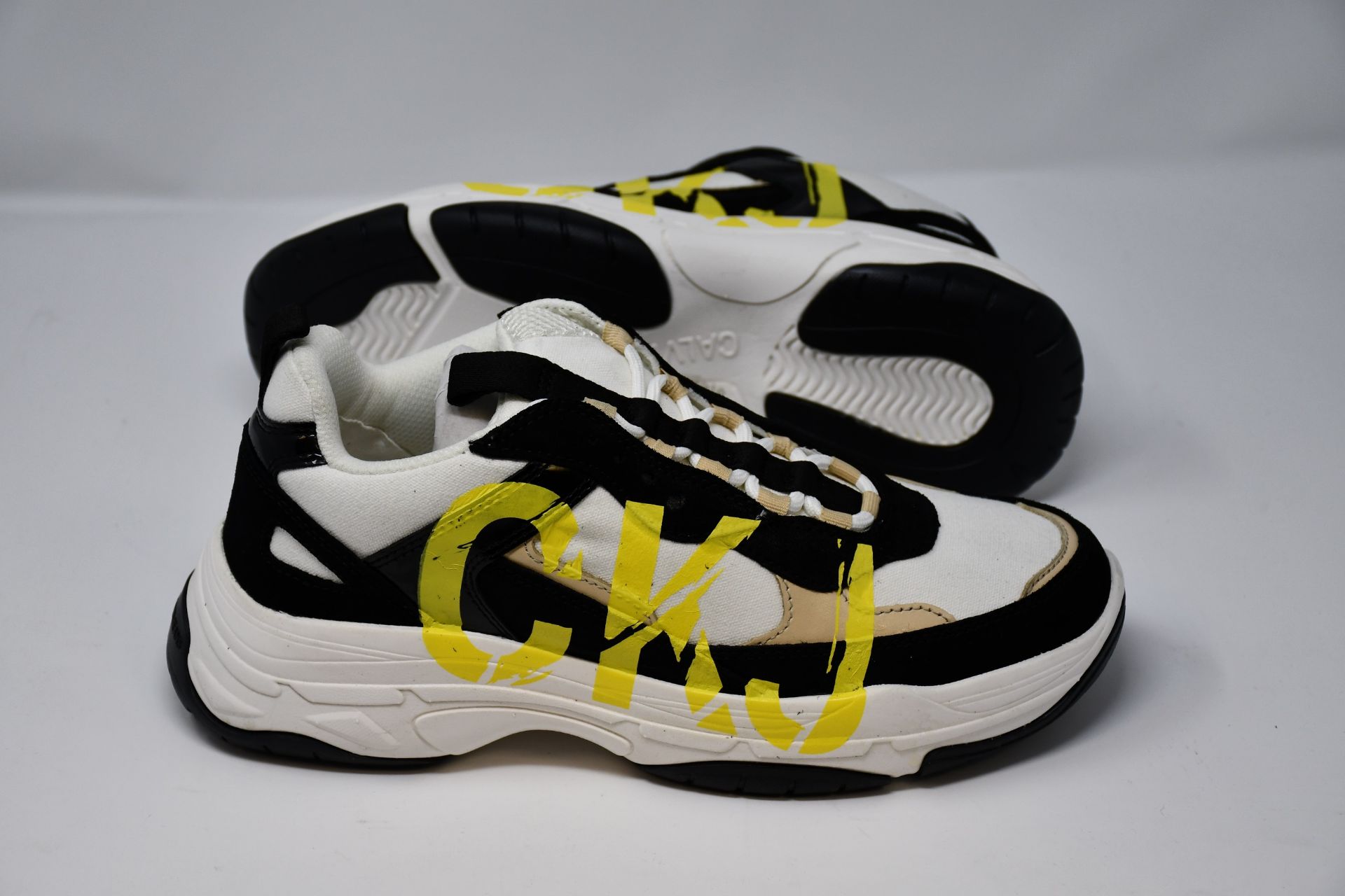 A pair of Calvin Klein Jeans Marleen low top lace up trainers (US 9).