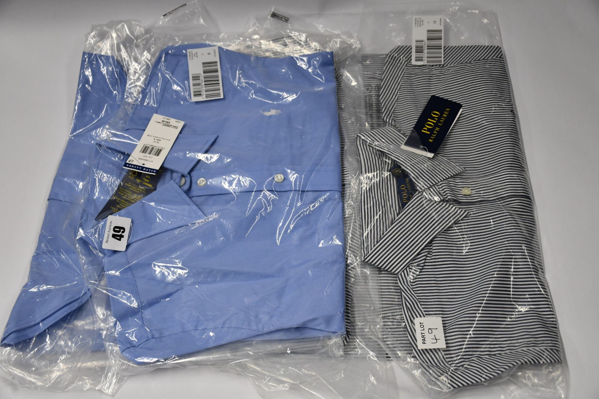 An as new Ralph Lauren Polo classic fit blue shirt (Size 8) and an as new Ralph Lauren classic fit