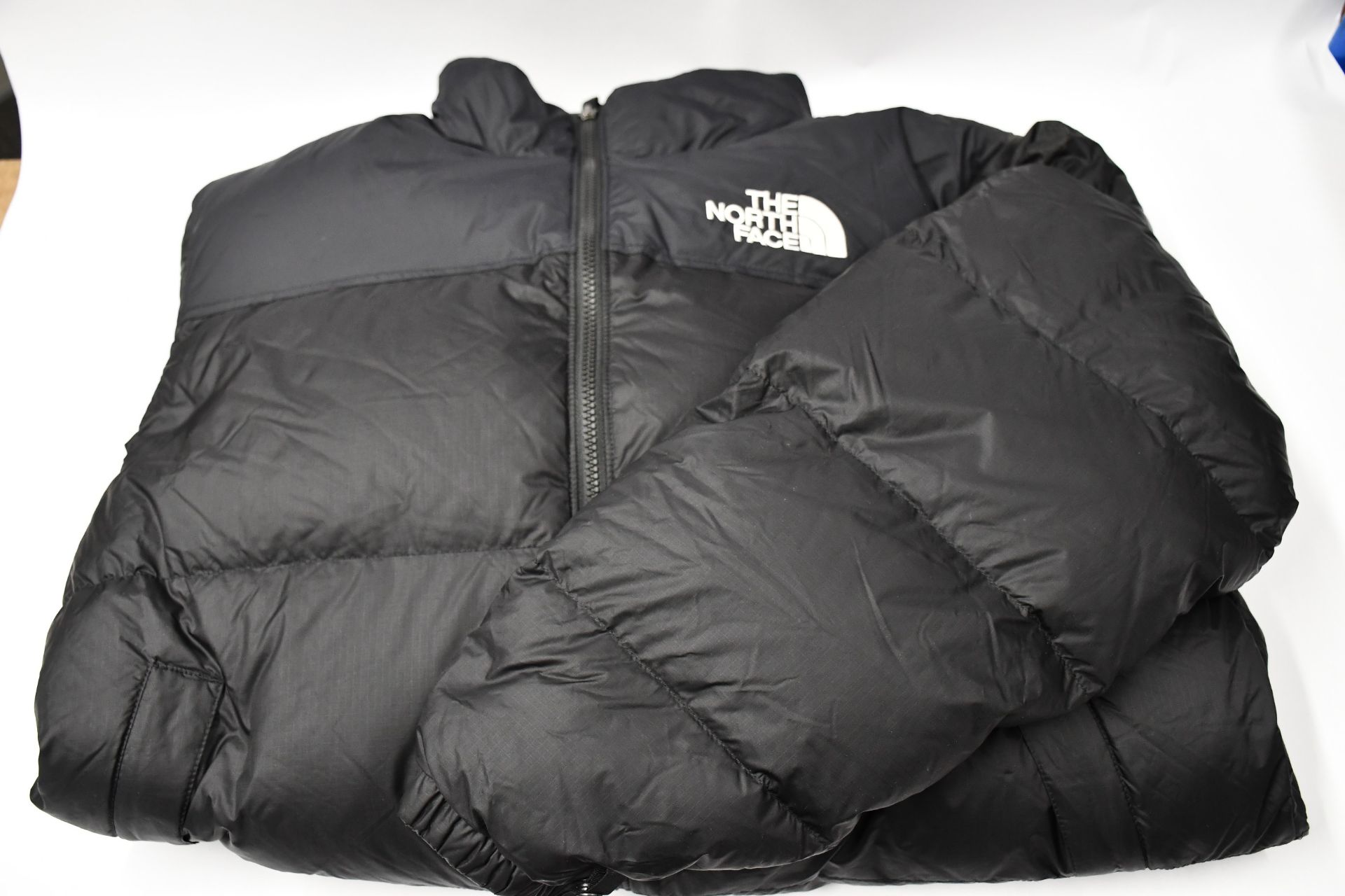 An as new North Face Iconic Nuptse retro down feather black puffer coat (Size L).