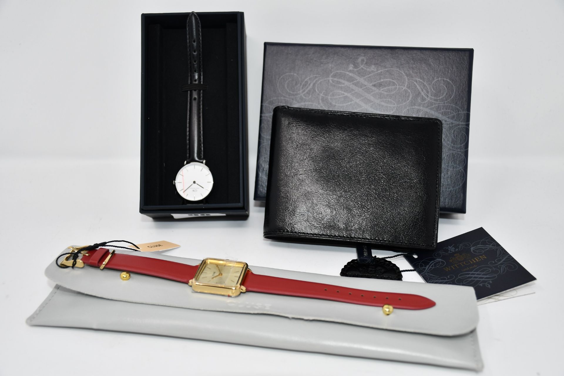 An as new Daniel Wellington watch, as new Cluse watch and a Wittchen leather wallet.