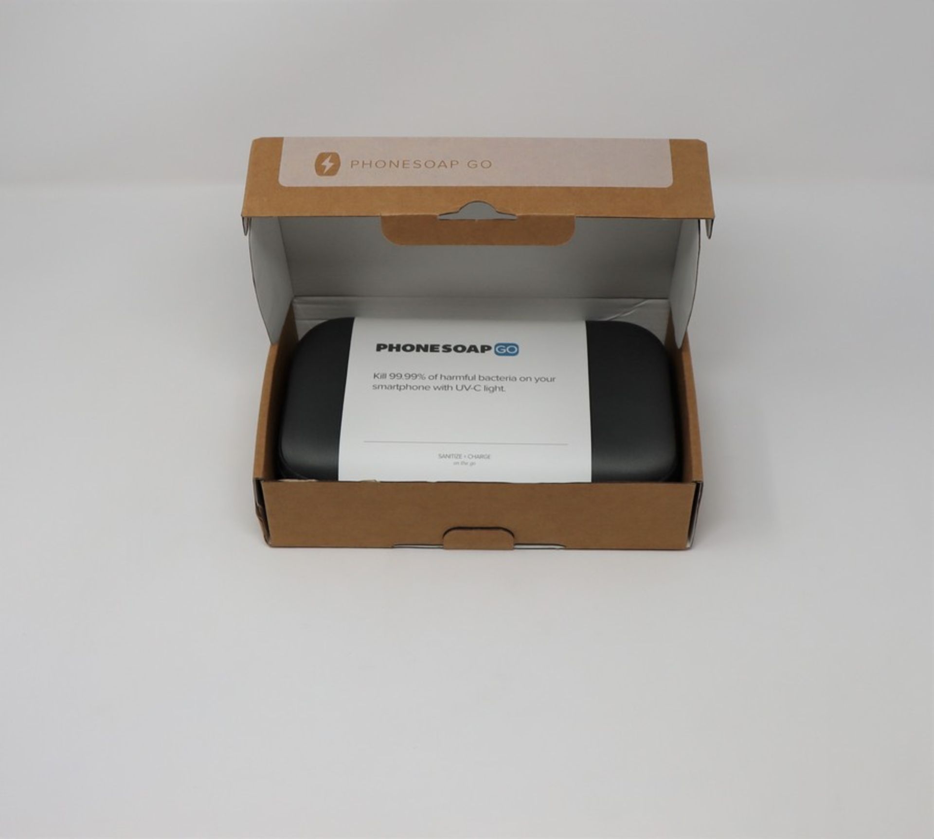 A boxed as new PhoneSoap Go UV Smartphone Sanitizer & Universal Charger in Indigo (Box opened).