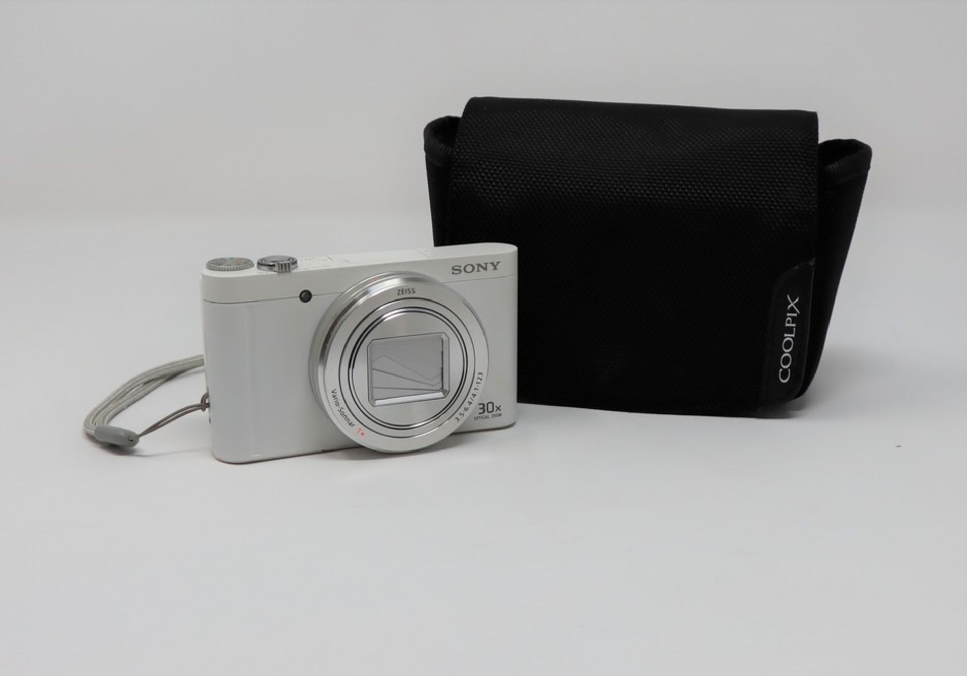 A pre-owned Sony Cyber-shot DSC WX500 Digital Camera in White with a Sony NP-BX1 battery, a