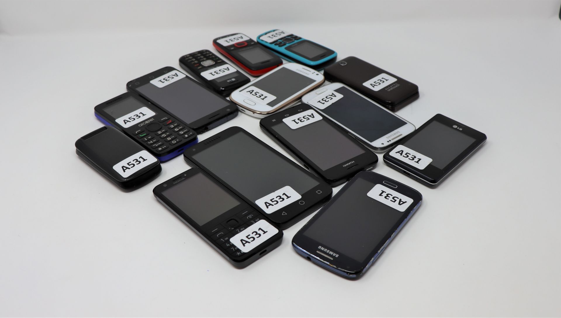 Fourteen pre-owned mobile phones including Alcatel, Samsung, Nokia and Huawei (Some with damaged