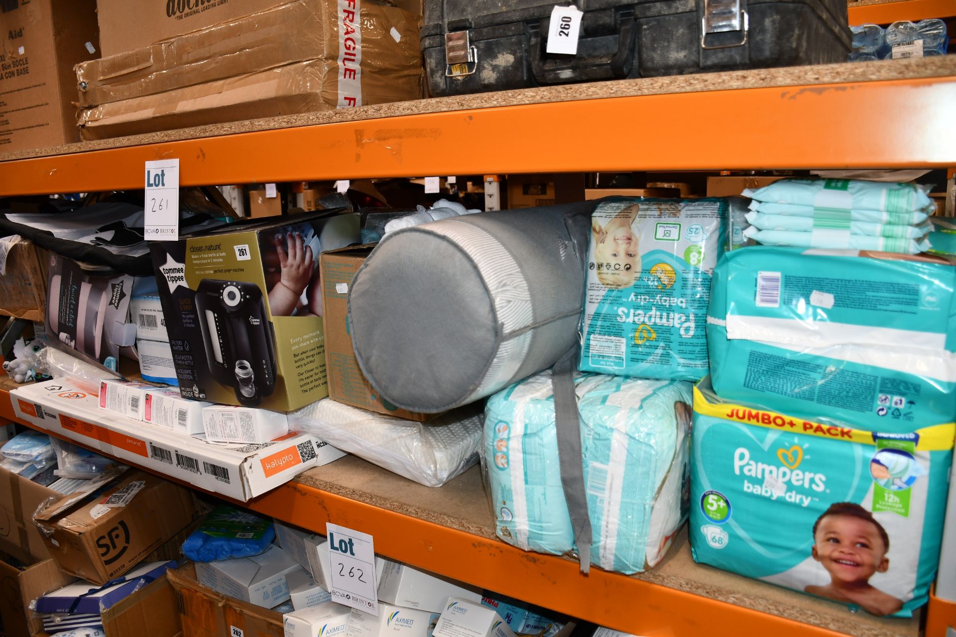 A quantity of baby related items to include pampers nappies, cot mattress and toys.