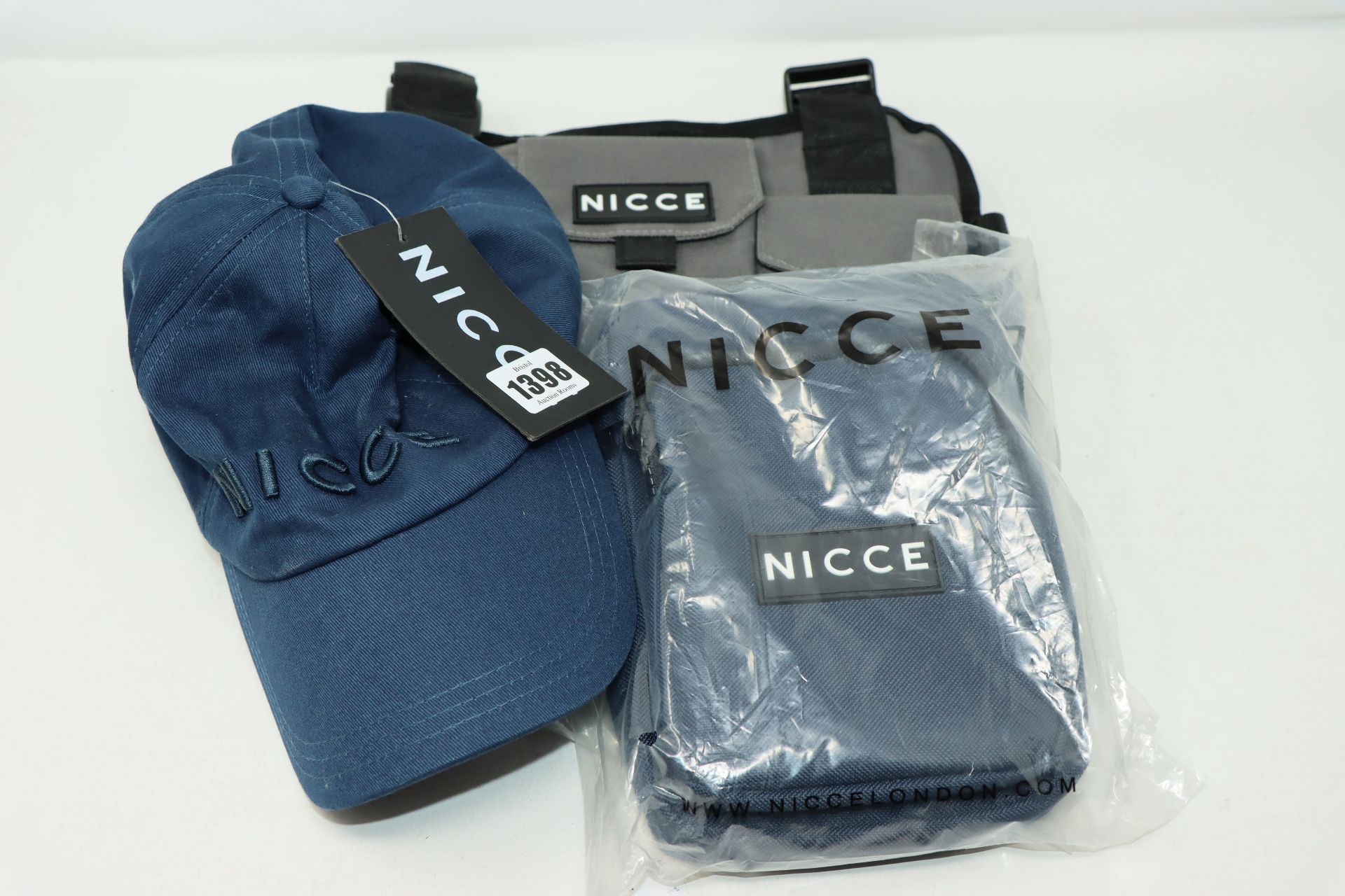 One as new Nicce Zil Chest Harness charcoal bag. One as new Remi blue bag. One as new Nicce blue