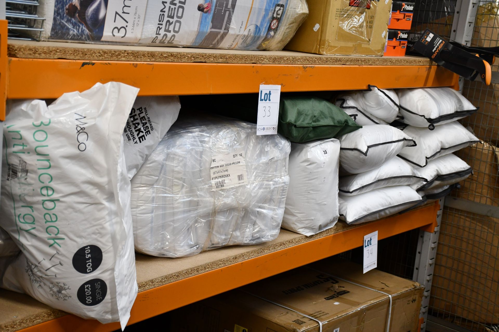 A quantity of assorted pillows, bedding and related items.