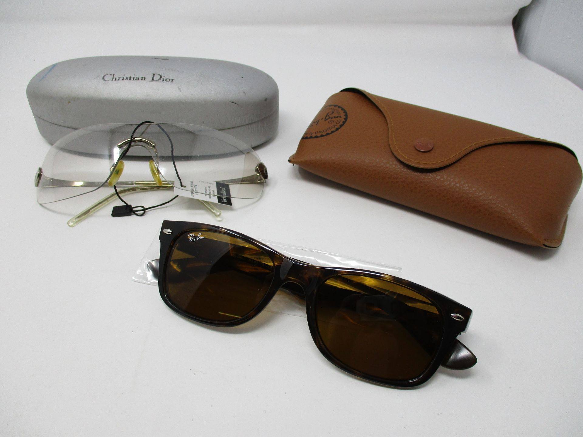 One as new Ray Ban New Wayfarer tortoise prescription sunglasses. One pre-owned Christian Dior clear