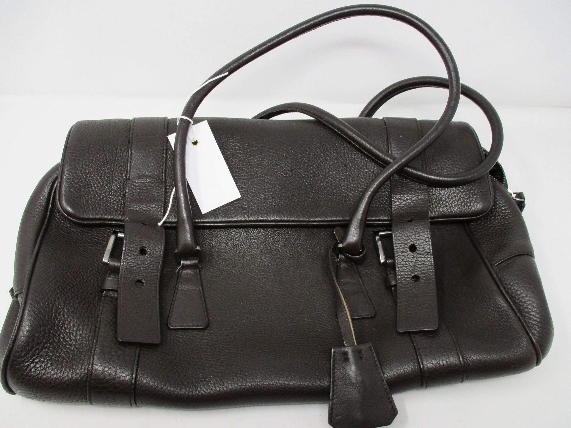 One pre-owned Prada dark brown leather handbag (Side of the internal coating is unstitched).