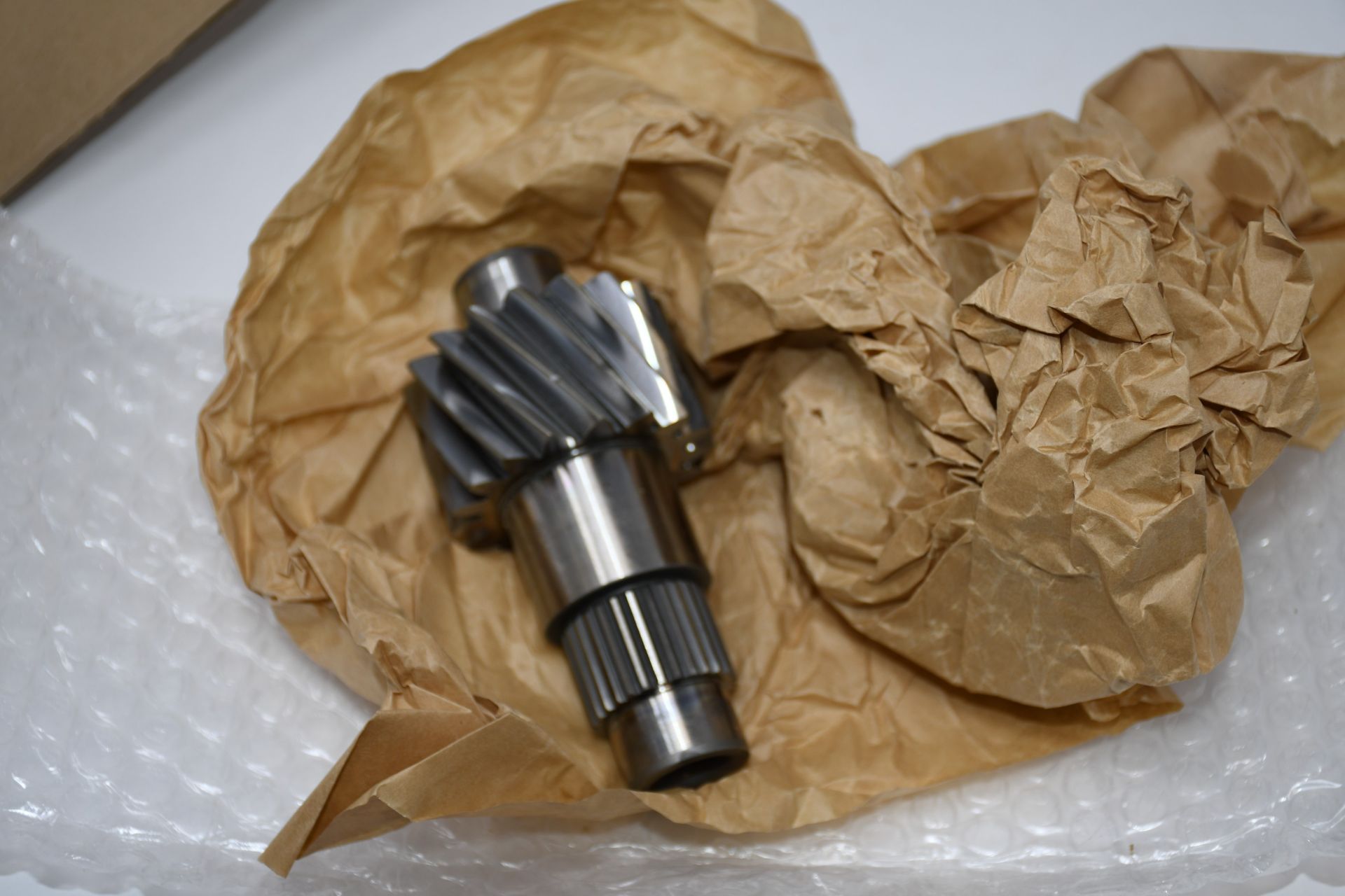 One boxed as new Ford gear bevel (SN CODE: ANIS-7061).