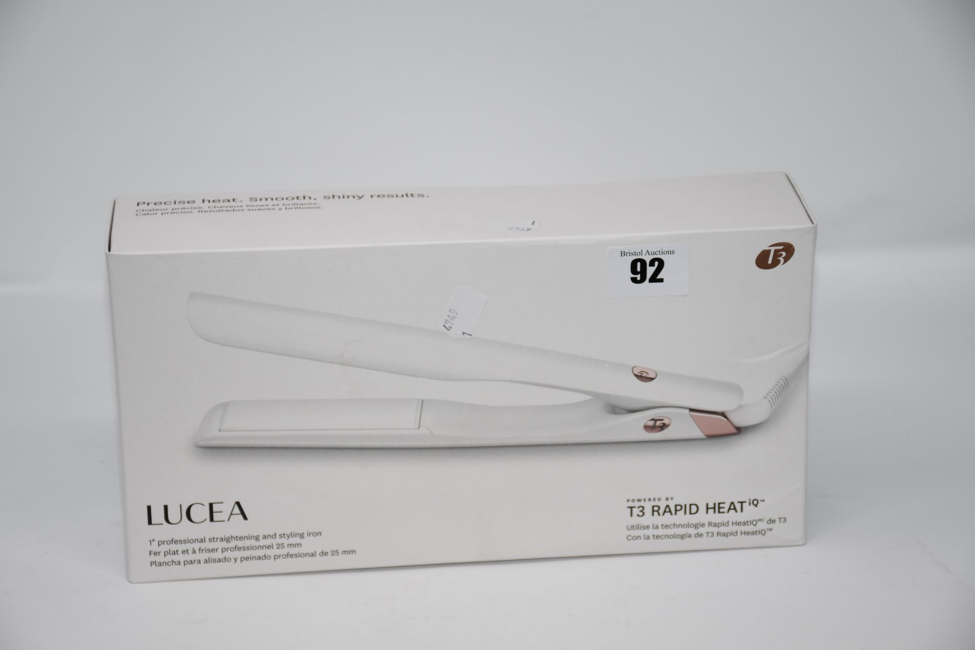 One boxed Lucea hair straightening and styling iron.