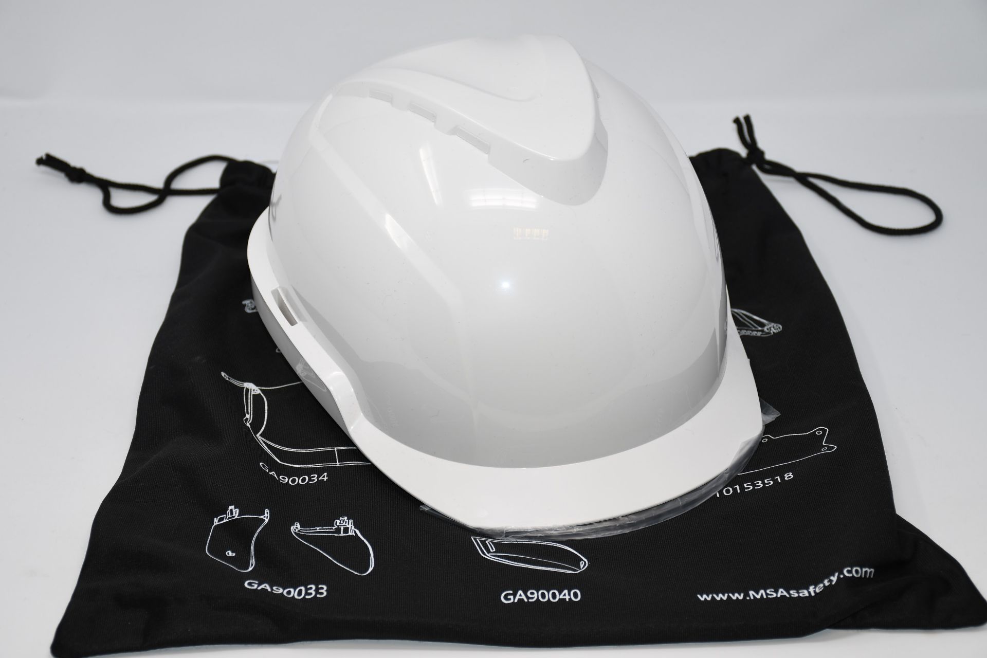 One as new MSA V-Gard 950 safety helmet in white.