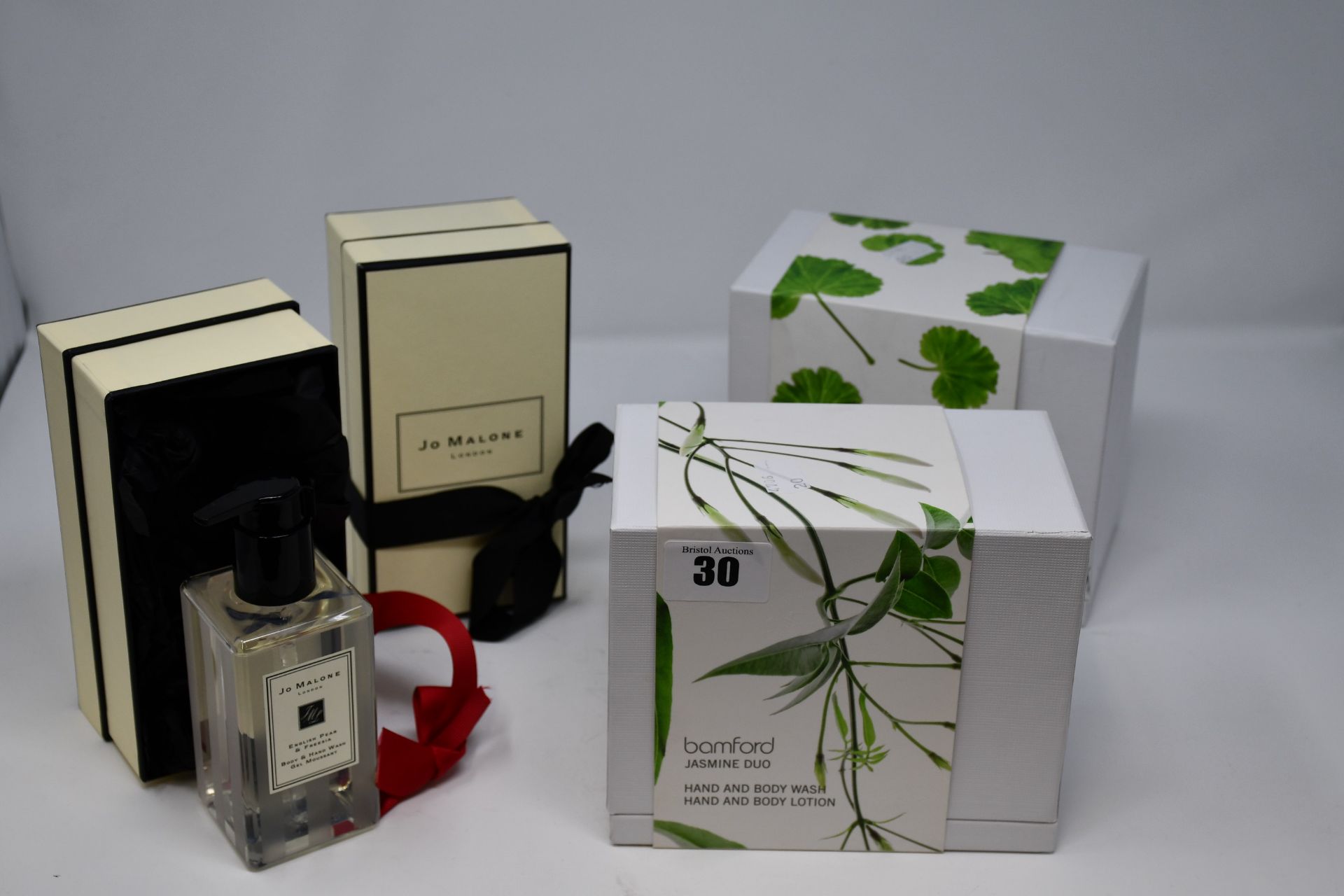 One Jo Malone English Pear & Freesia body and hand wash (250ml), one Jo Malone Red Roses body and