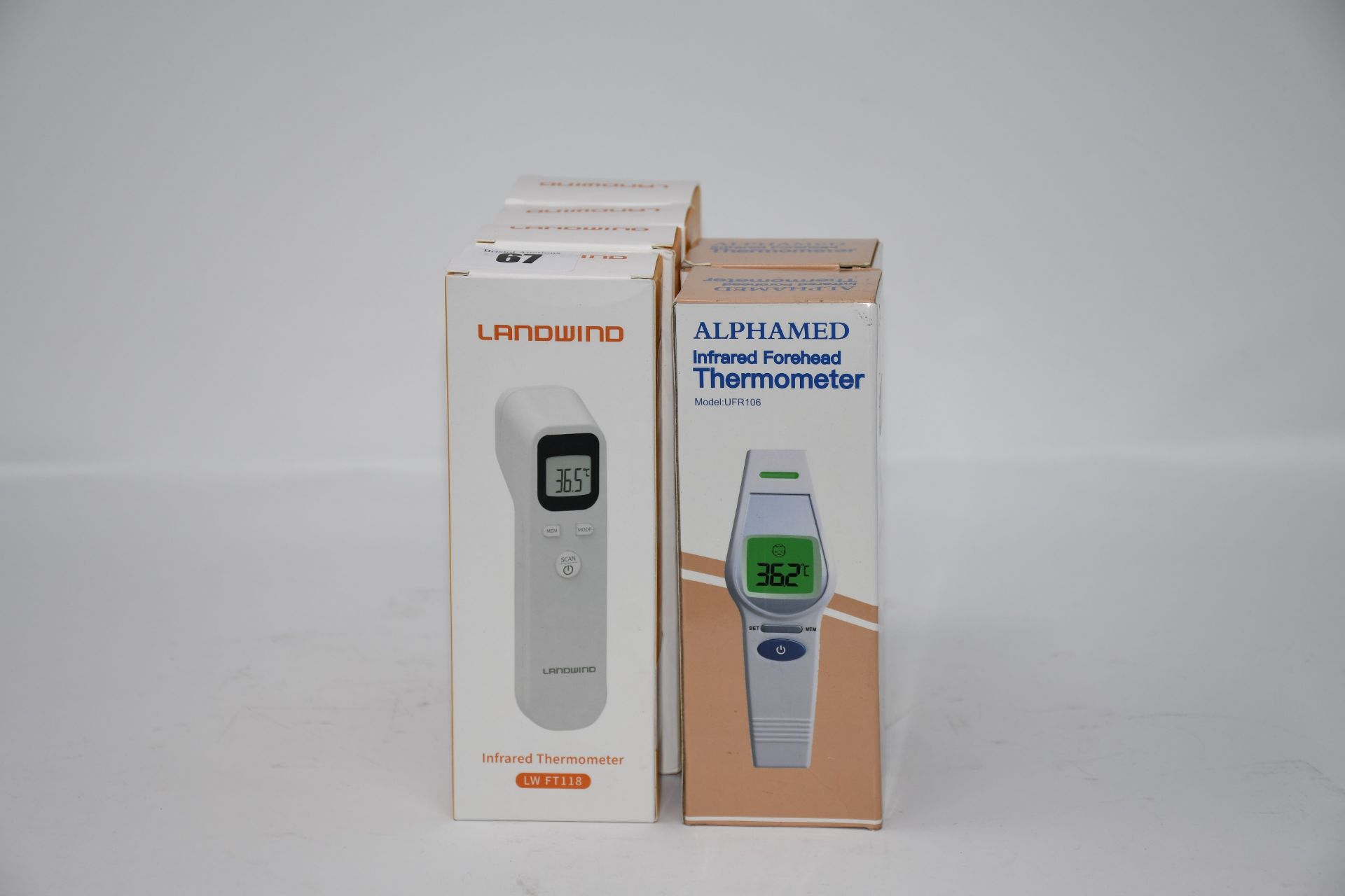 Four Landwind (LW FT118) and two Alphamed (UFR106) infrared forehead thermometers, all boxed as