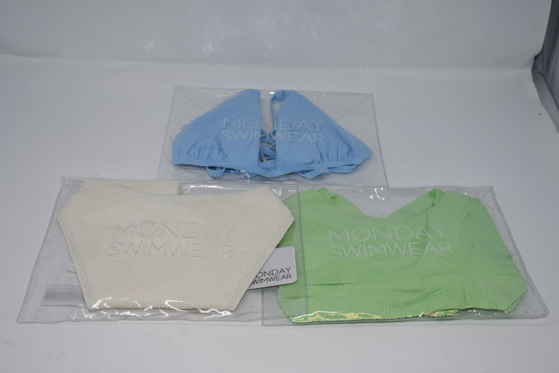 An as new Monday Jamaica kiwi rib swimwear top (L), an as new Monday Barbados sky blue rib top (L)