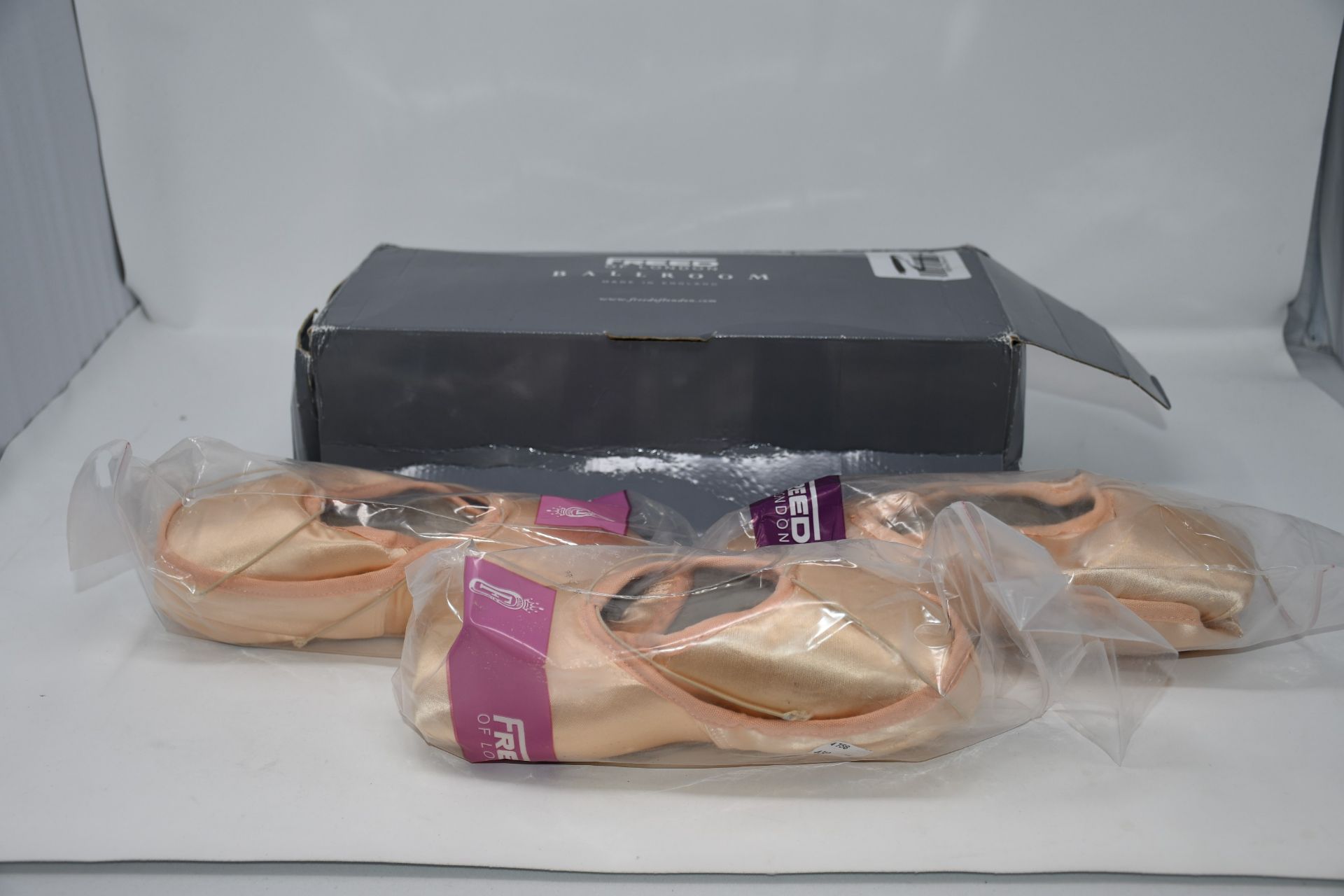 Two pairs of Freed of London pointe shoes size 5. One pair of Freed of London pointe shoes size 7.