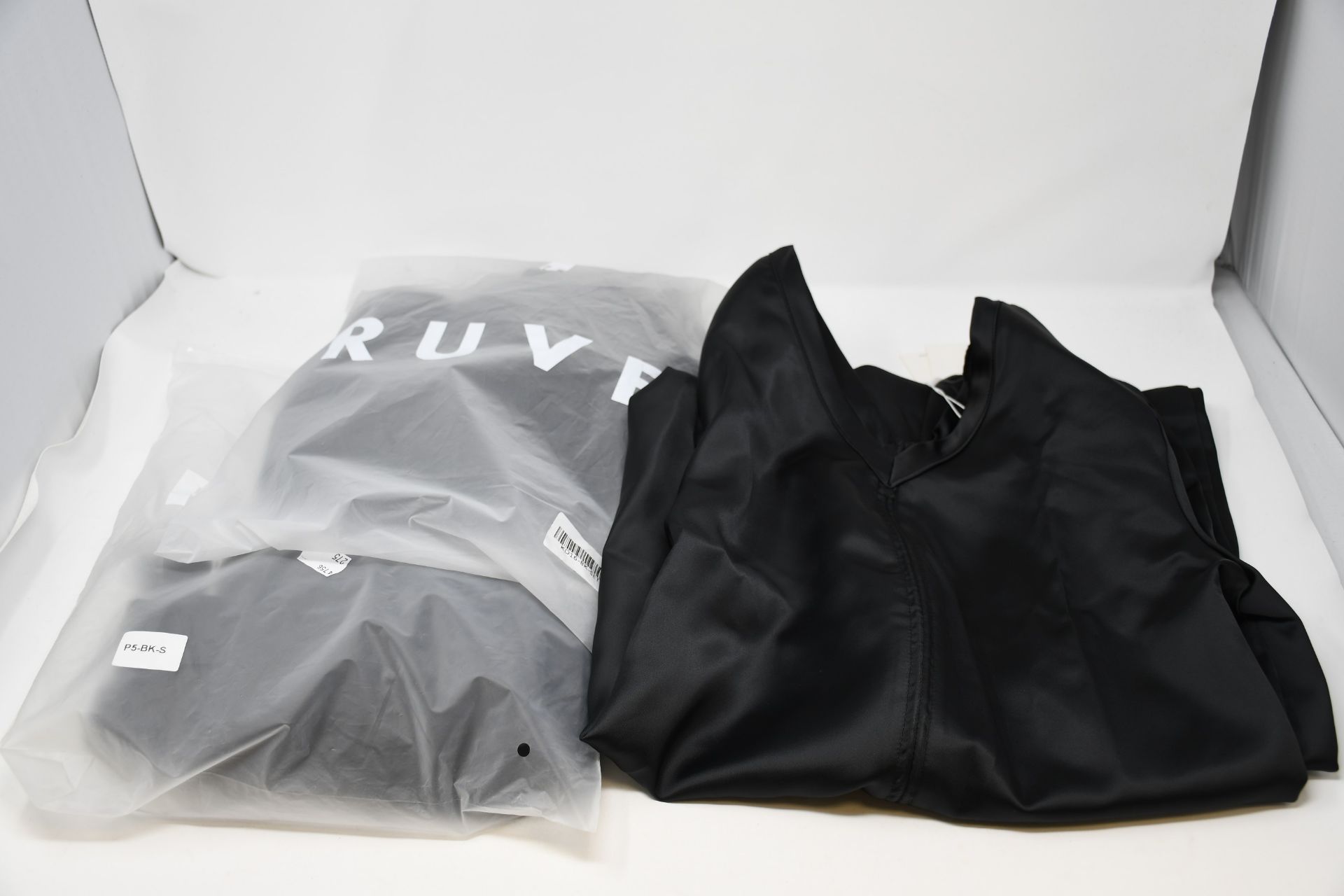 One as new Ruve LOE pants (size unknown). One as new Ruve Shera Dress. One as new Ruve black dress.