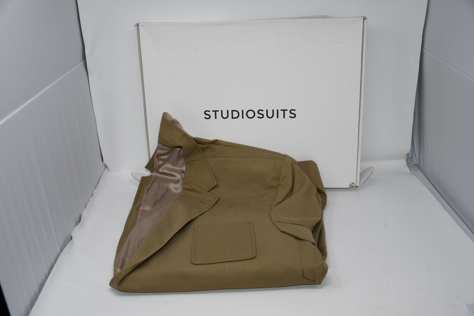 One as new Studio Suits beige blazer size unknown.