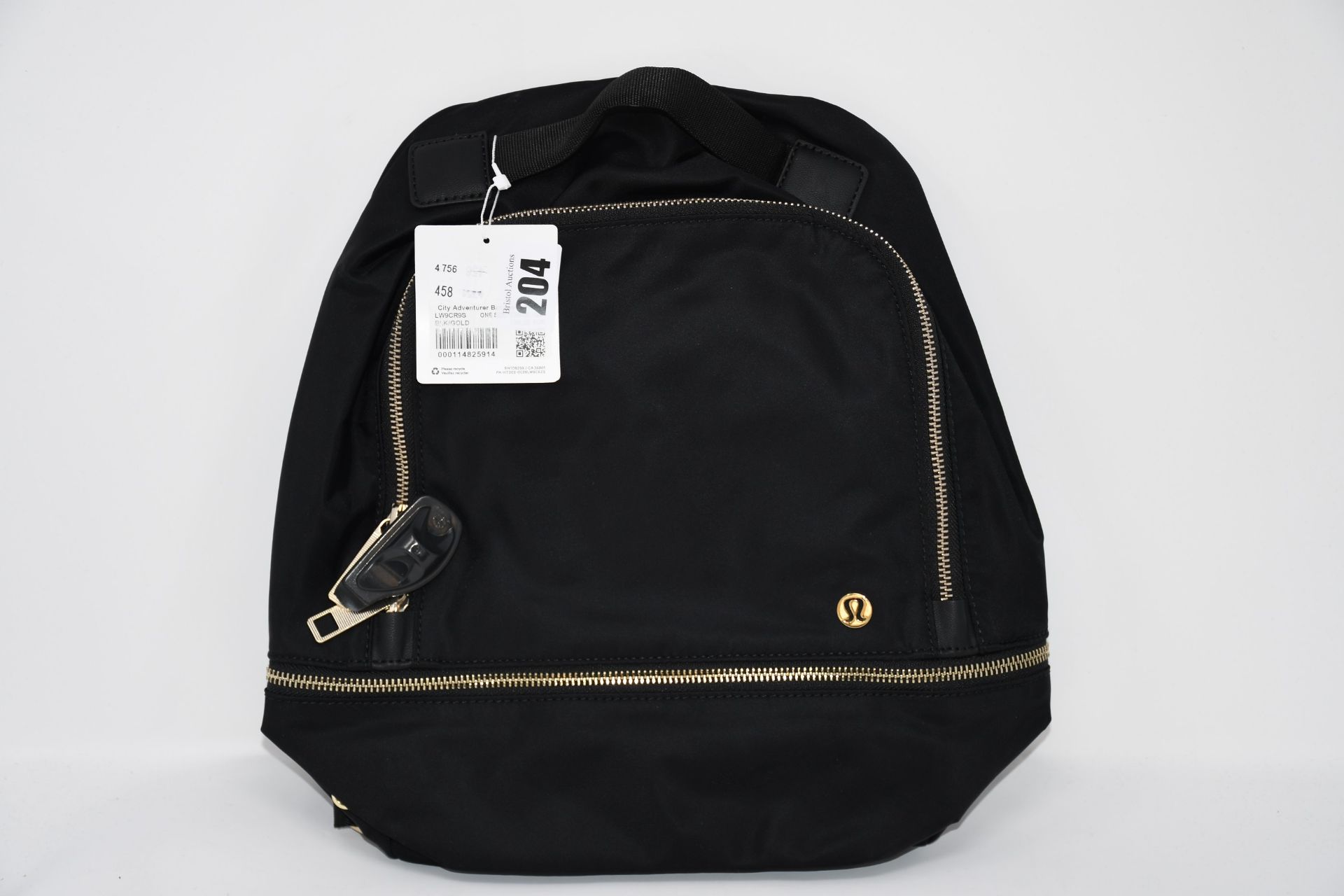 One as new Lululemon City Adventurer Backpack Mini (Colour: black/gold. Model: LW9CR9S).