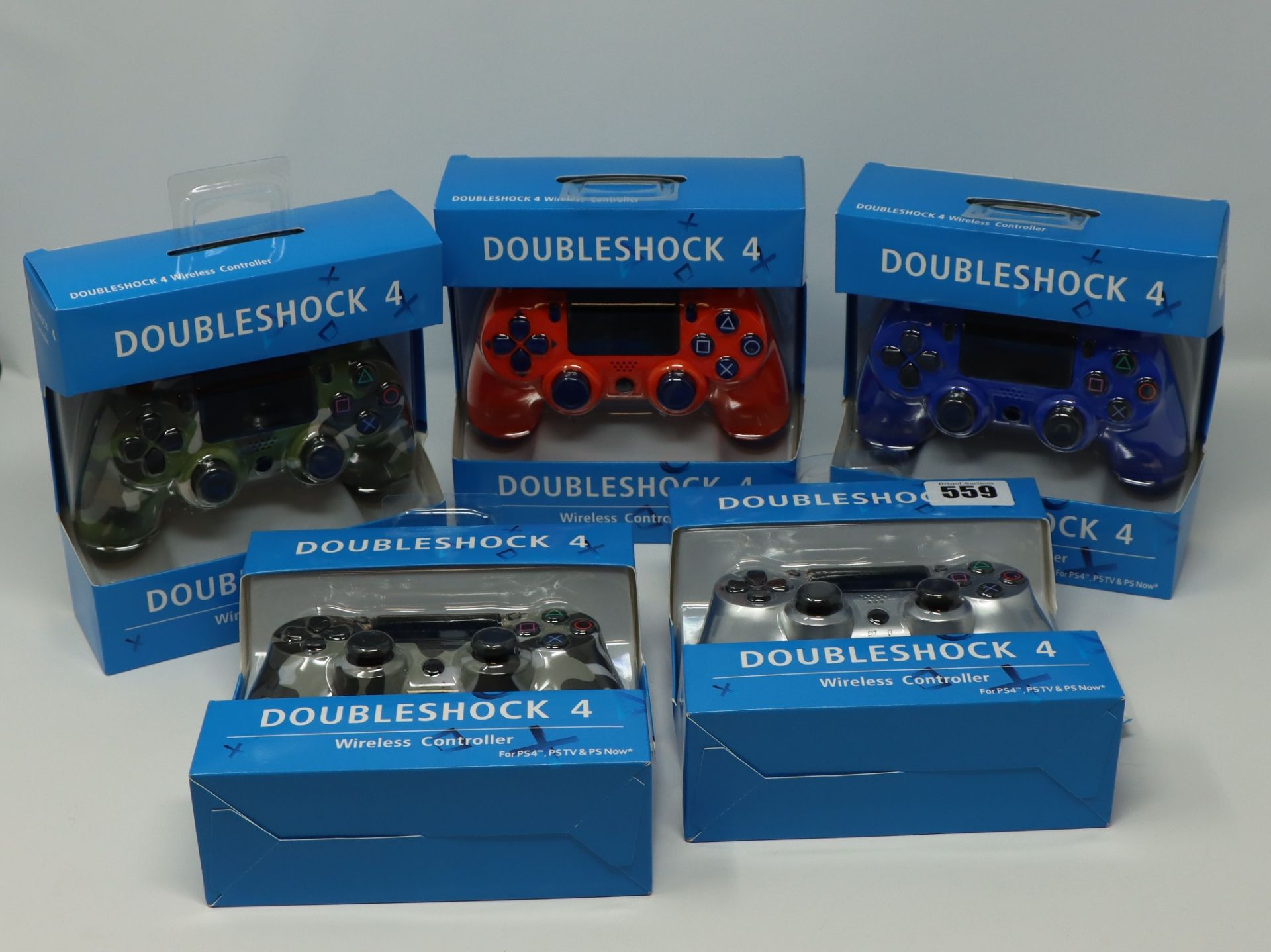 Five boxed as new Doubleshock wireless controllers for the PS4, PS4TV, & PS Now, various colours.
