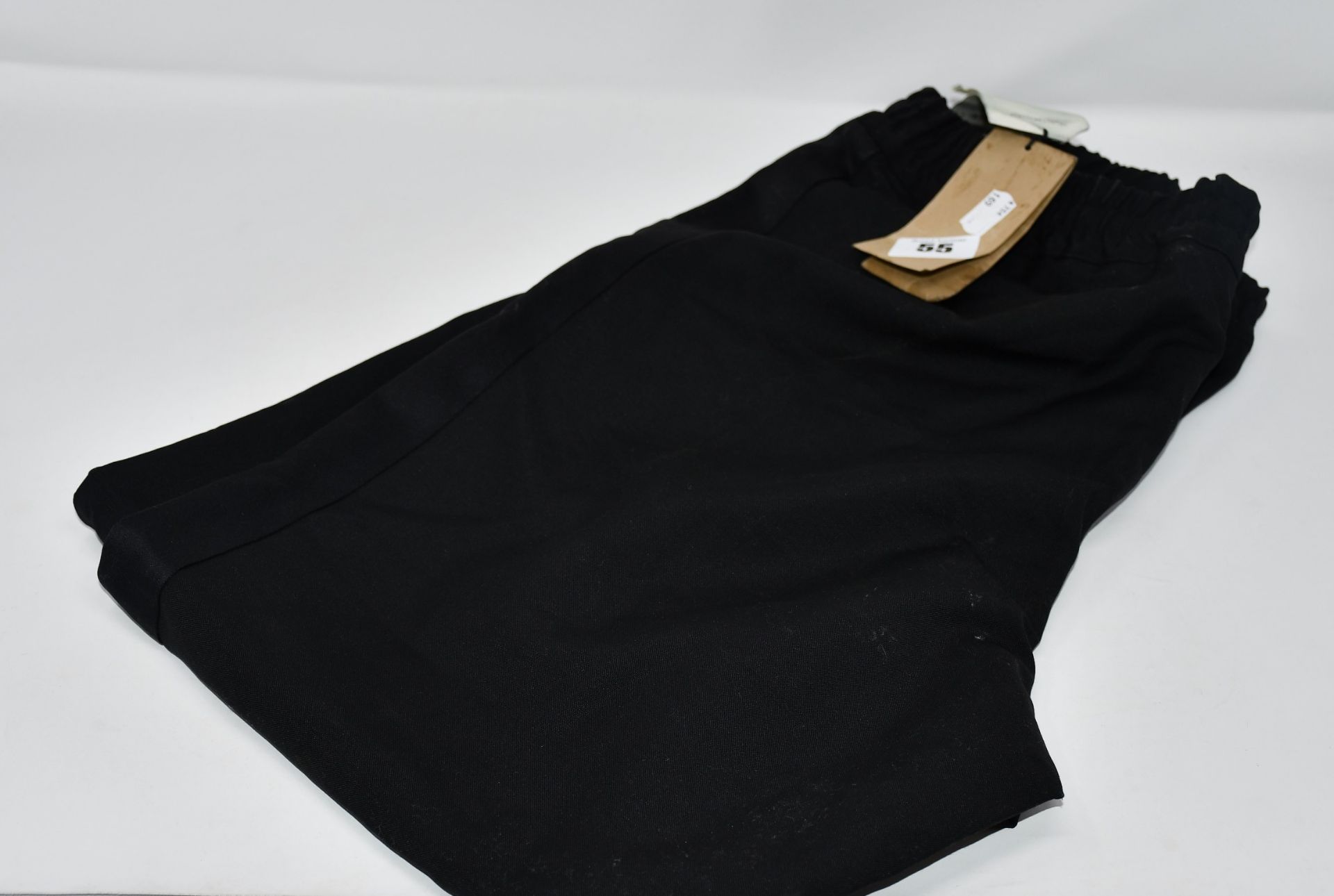 One as new Burberry black trousers size 50 (several marks on the back of the trousers).