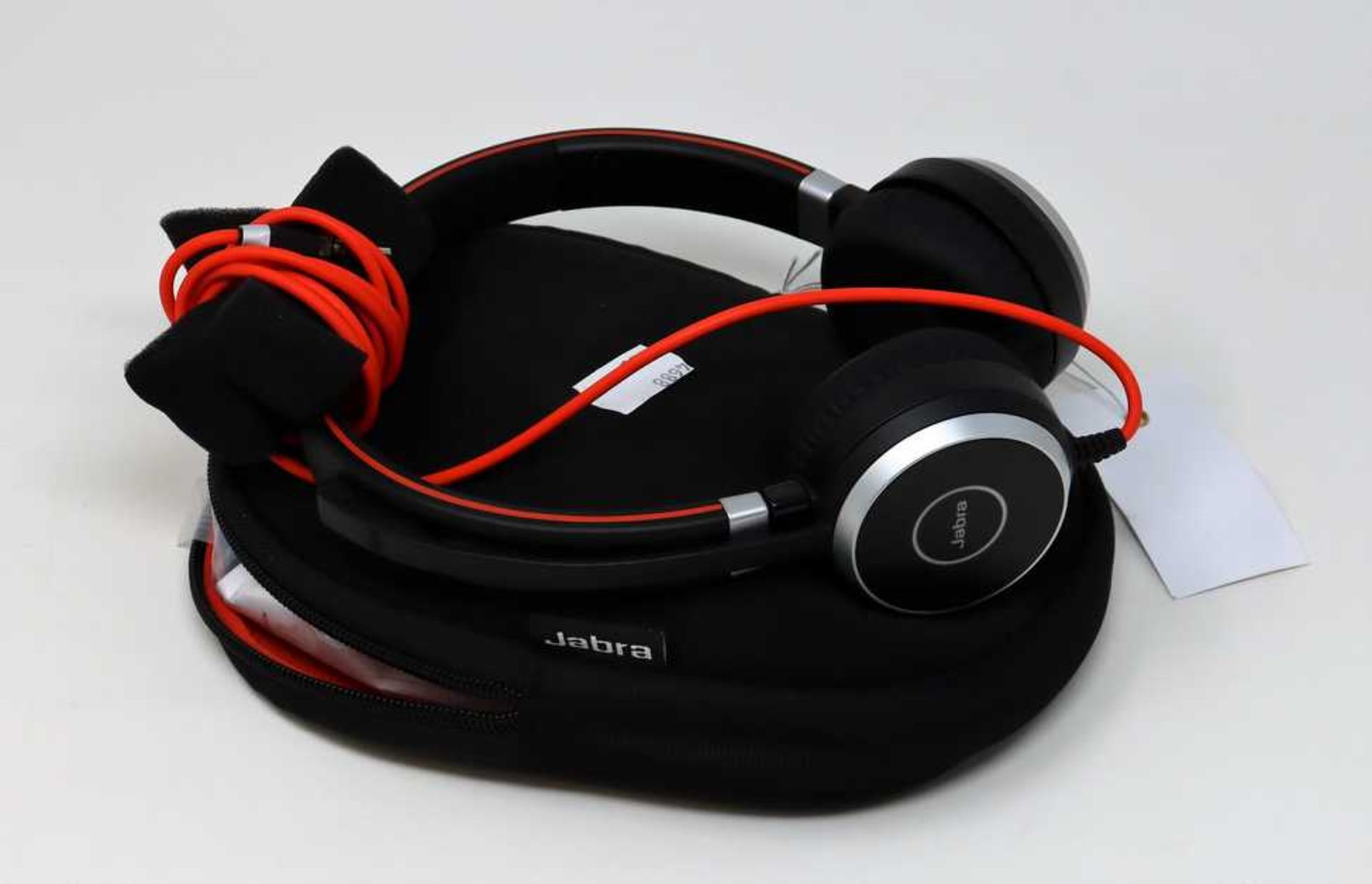 A pre owned Jabra Evolve 40 UC Stereo On-Ear Headset w/ 3.5mm Jack, USB Controller and Case.