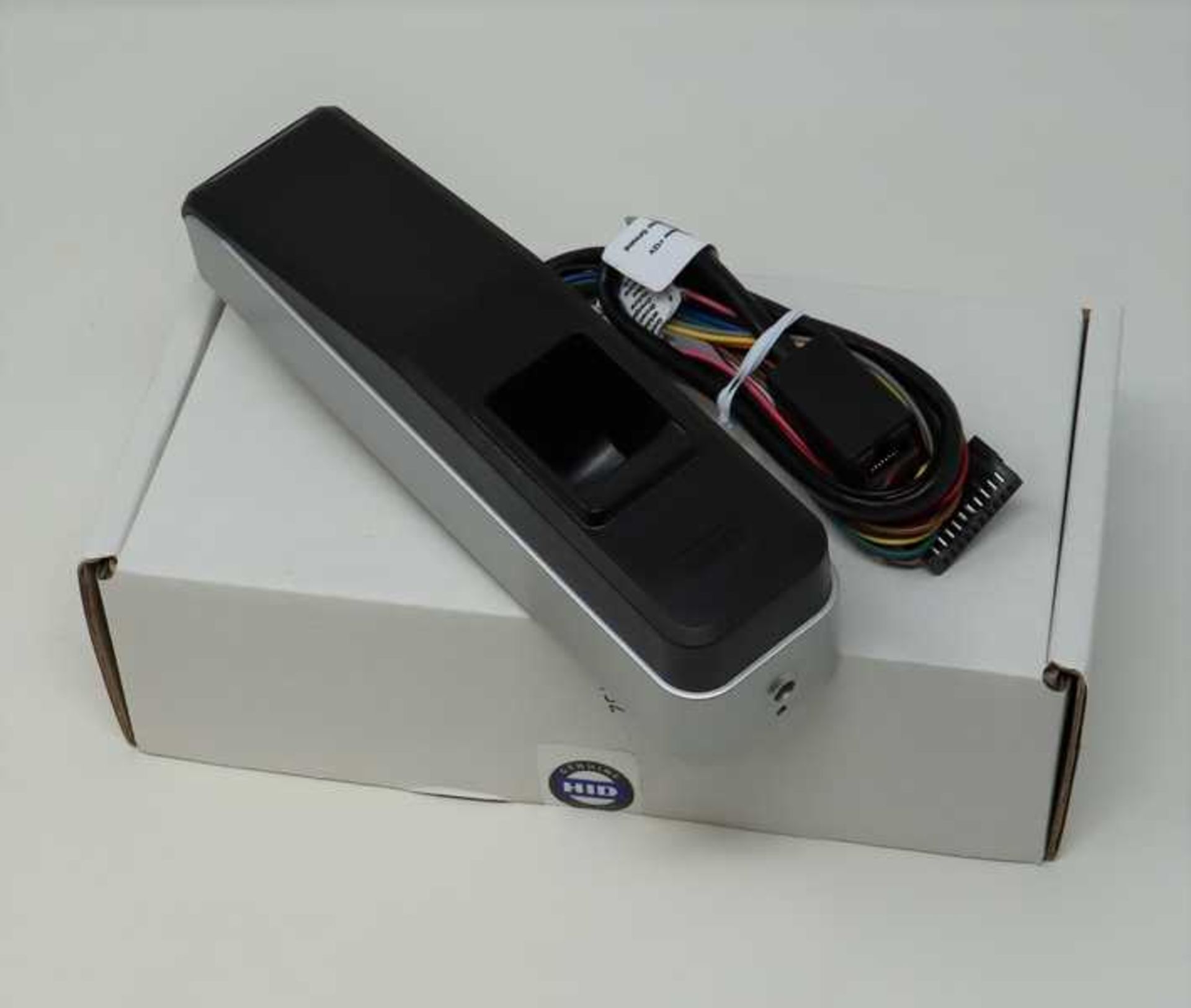 A boxed as new HID iCLASS SE RB25F Mullion Fingerprint Reader/Controller (P/N: RB25FNK-00-0000-0000)