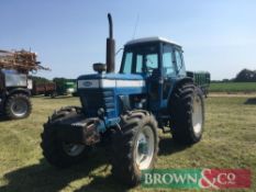 1983 Ford 8210 4wd tractor with front wafer weights, 2 manual spools on 14.9R28 front and 600/55R38