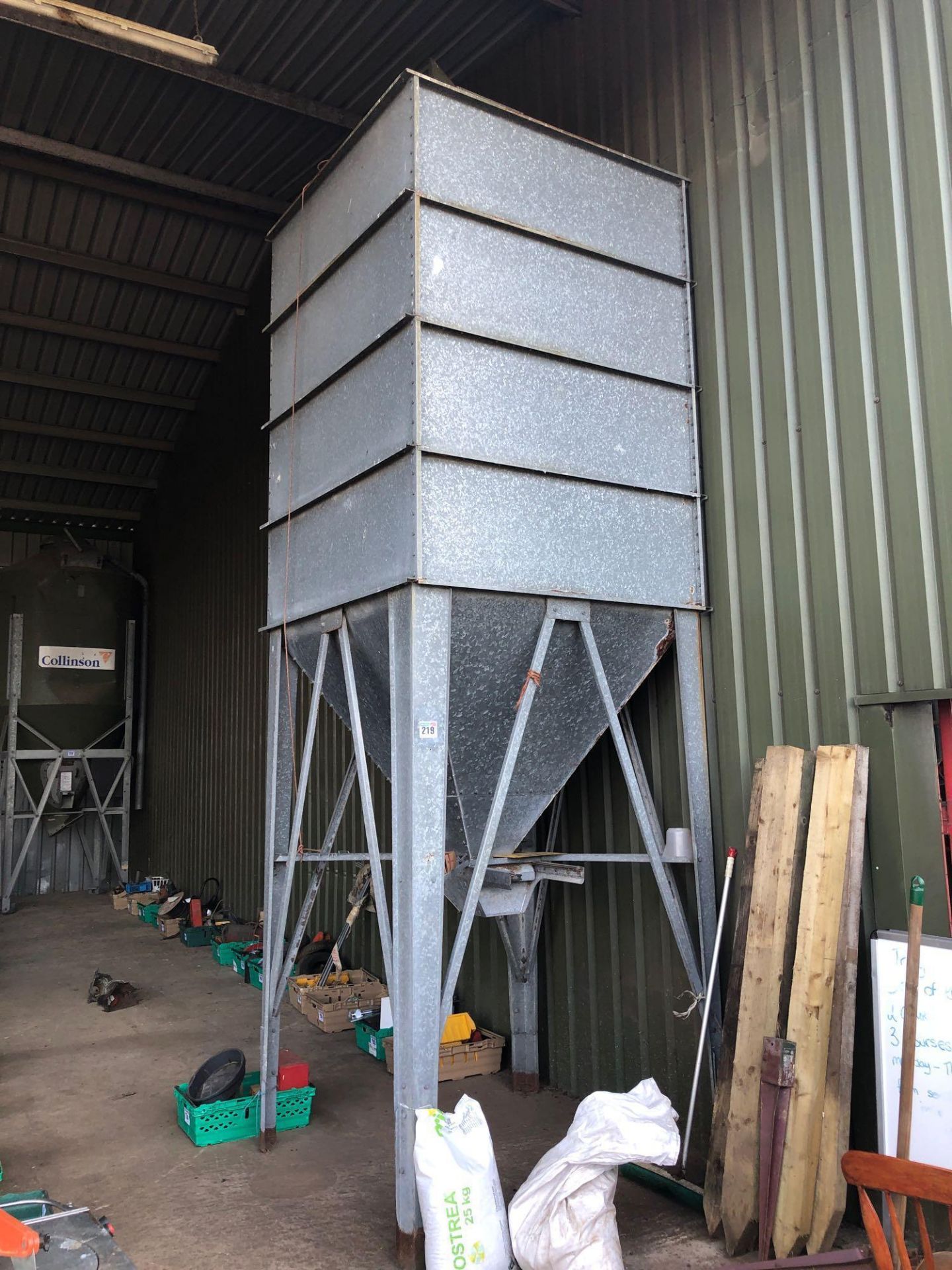 Galvanised feed hopper on stand (sold in situ)