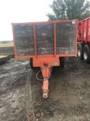 1973 Pettit twin axle wooden tipping grain trailer, with drop sides. Serial: 17636