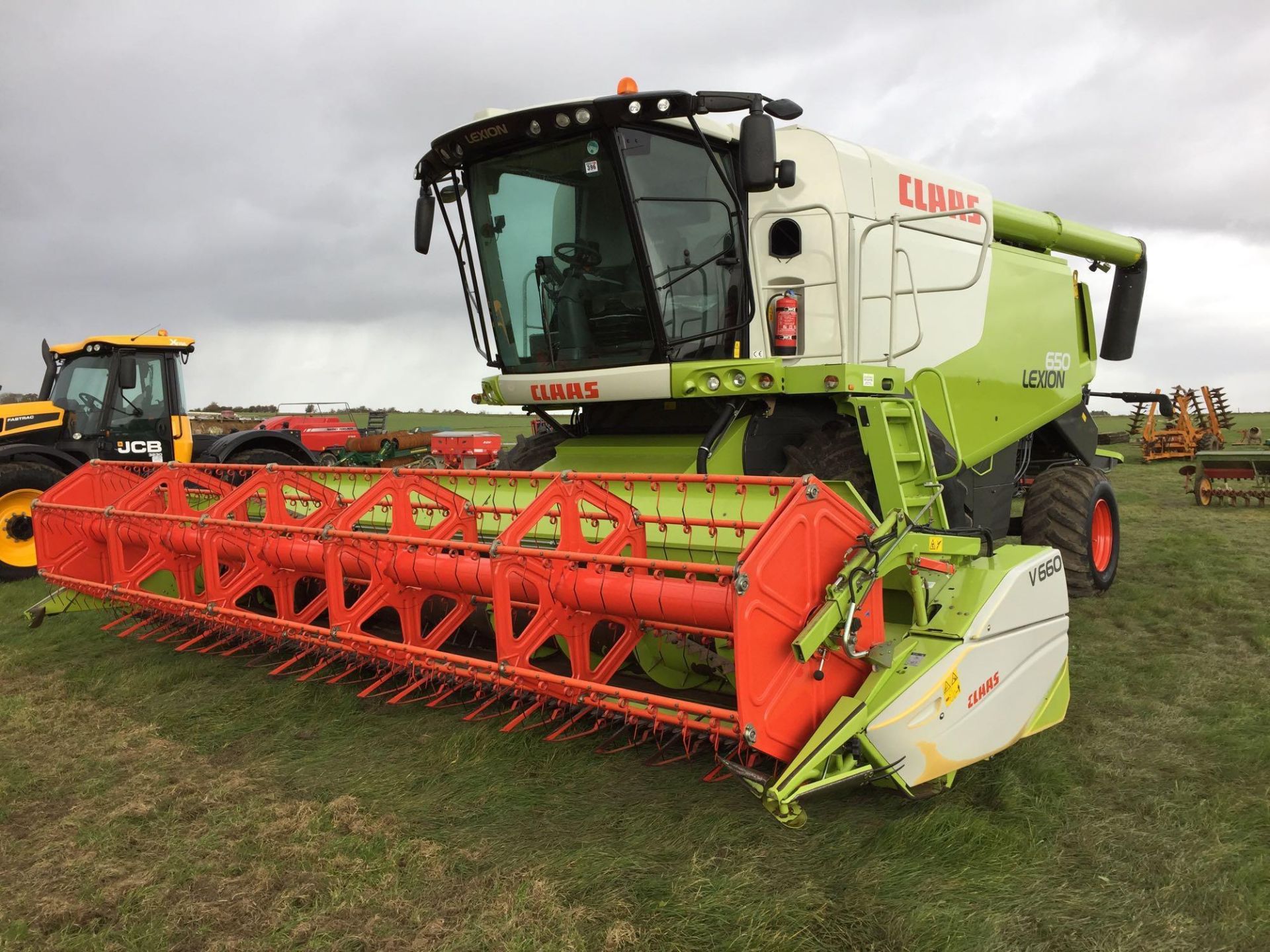 2014 Claas Lexion 650 combine harvester with V660 (22ft) header and header trolley with side knife a