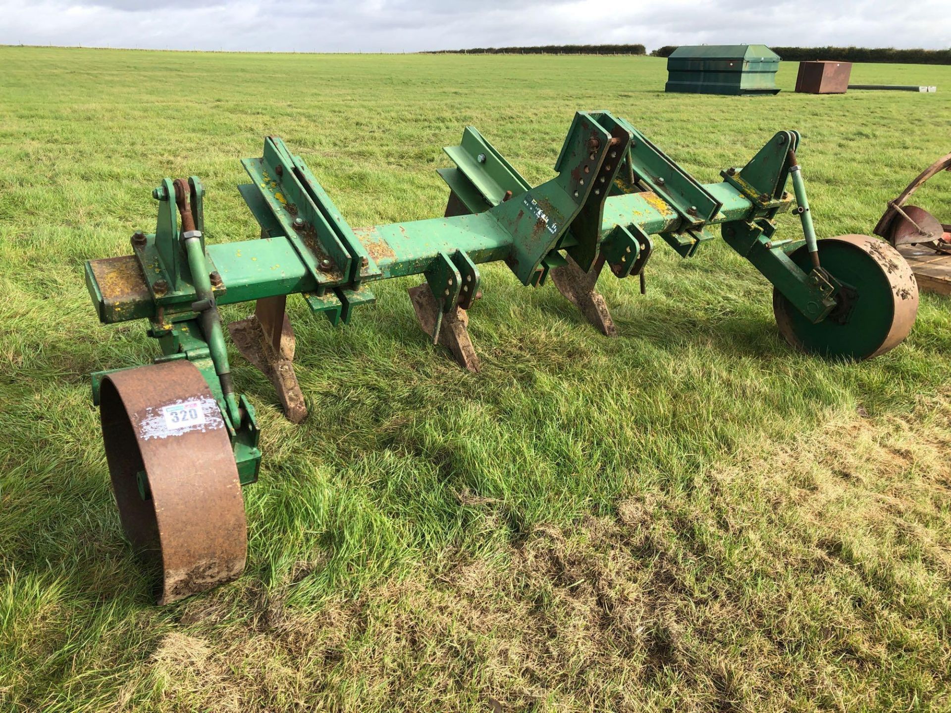 Cousins triple leg linkage mounted sub soiler with depth wheels