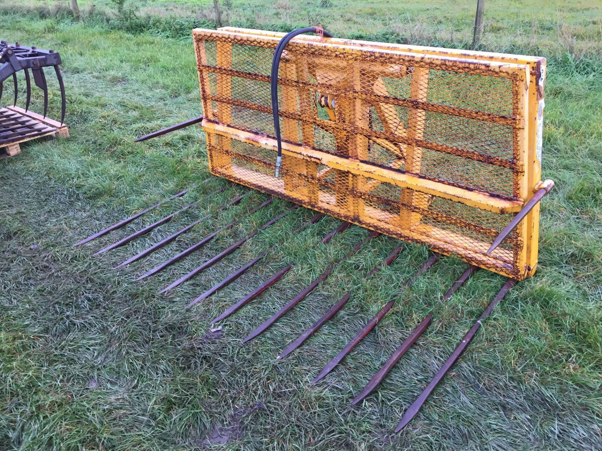 Grays linkage mounted buck rake with hydraulic push off