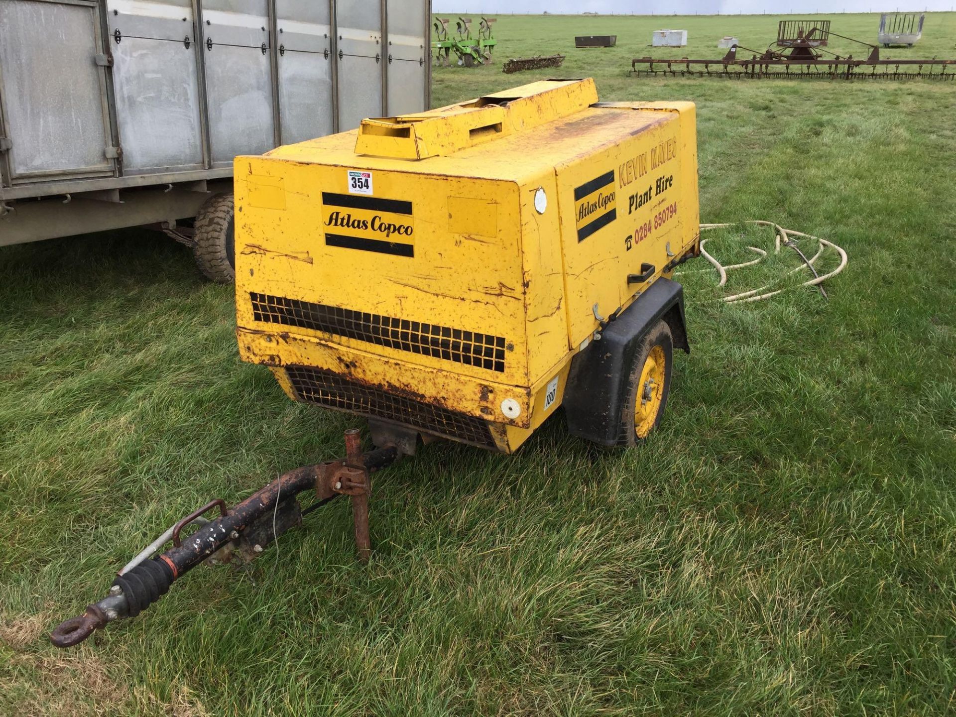 Atlas Copco trailed air compressor with diesel engine and pipes. Hours: 1926