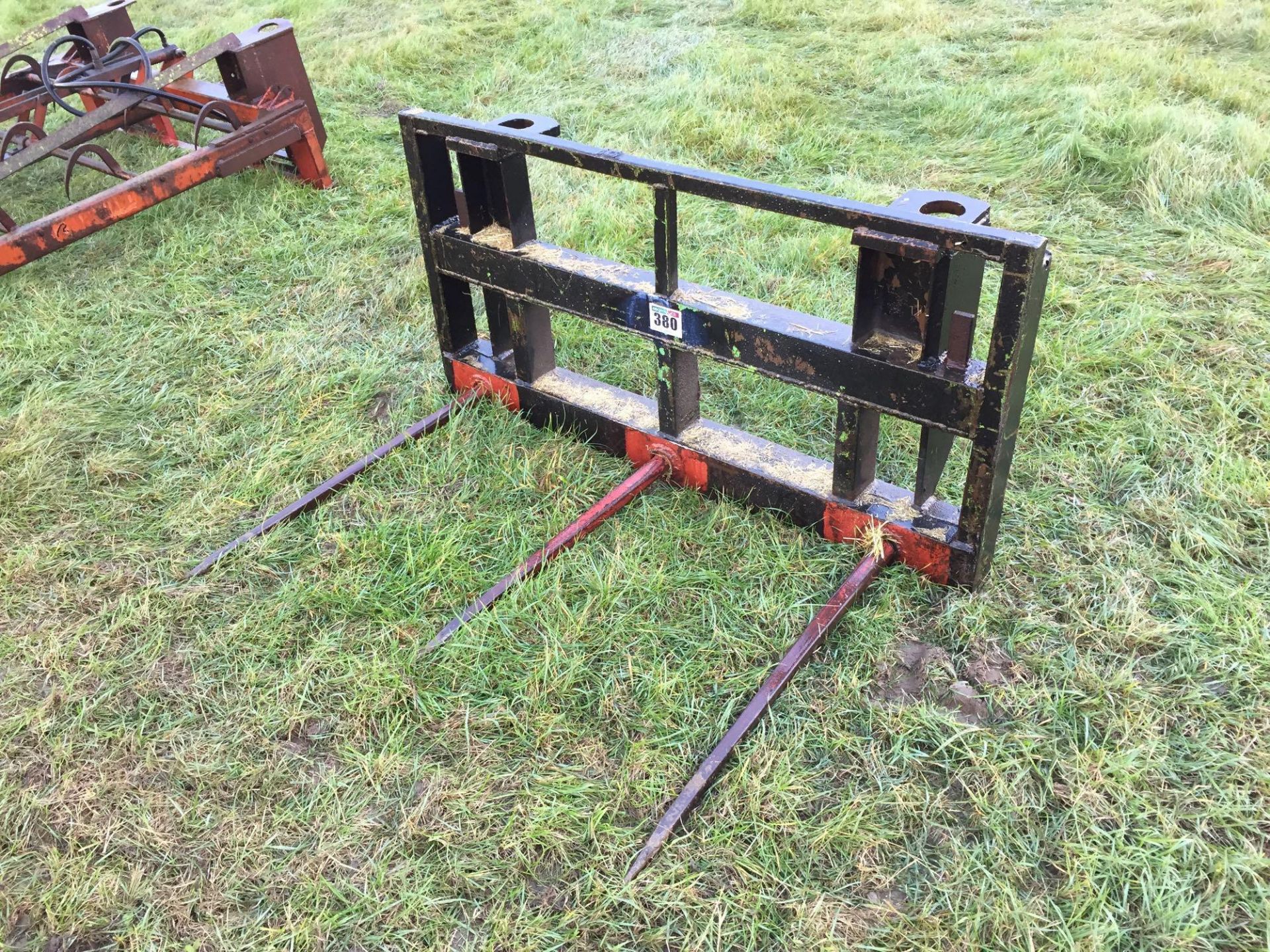 Farm made bale spike with pin and cone attachment