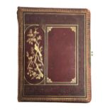 A 19th century photo album, cover decorated with a gilt embossed bird amongst branches, filled