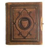 A Victorian photo album 'Album Belgravia', leather bound with intricate embossed front cover design,