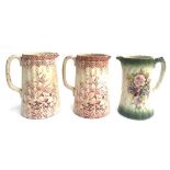 A pair of ironstone transferware pitchers, decorated with burgundy lily design, each 20cmH; together