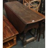 An oak drop leaf table with single end drawer, 125cmL
