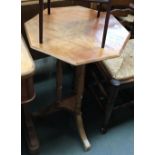 A pine octagonal tip-top table; together with a three-tiered mahogany cake stand, 51cmW