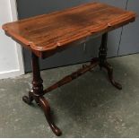 A rosewood side table, on turned supports and central turned stretcher, 91cmW