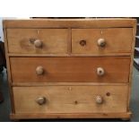 A very small pine chest of two short over two long drawers, 86x43x74cmH