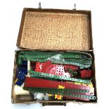 A suitcase filled with Meccano, to include wheels and a motor