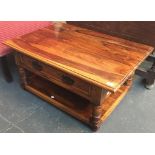 A teak coffee table with undershelf and single two way drawer, 88cmW