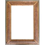 A rectangular wall mirror with bevelled glass, set within a leopard print leather frame with metal