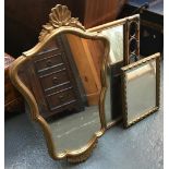 A bamboo frame wall mirror; a gilt framed wall mirror with shaped plate and shell cresting and one